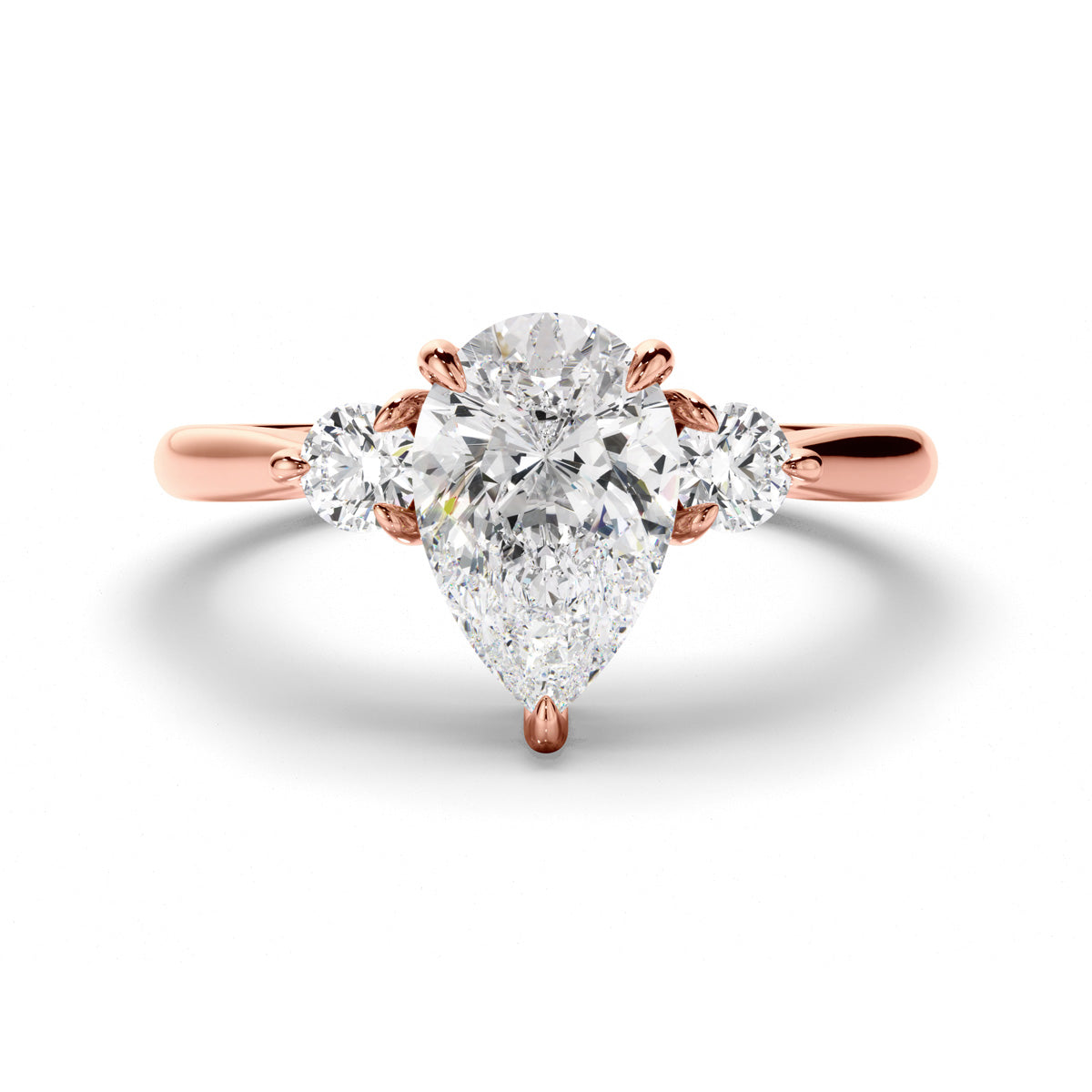 Pear Cut Diamond Trilogy Engagement Ring with Round Brilliant Sides