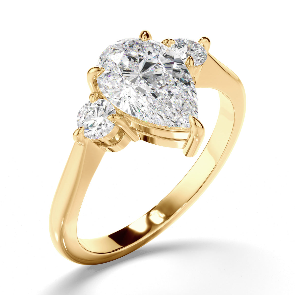 Pear Cut Diamond Trilogy Engagement Ring with Round Brilliant Sides