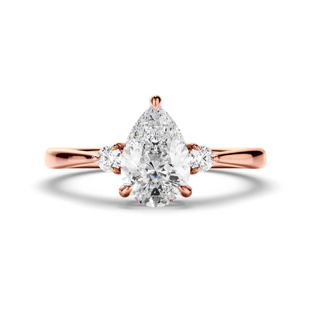 Pear Cut Diamond Trilogy Engagement Ring with Round Brilliant Sides